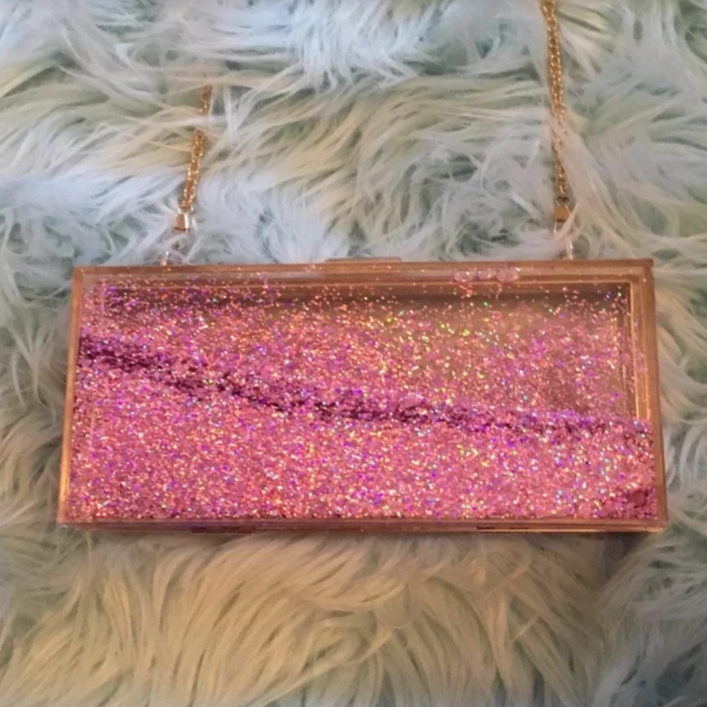 Skinnydiplondon moving  glitter clutch